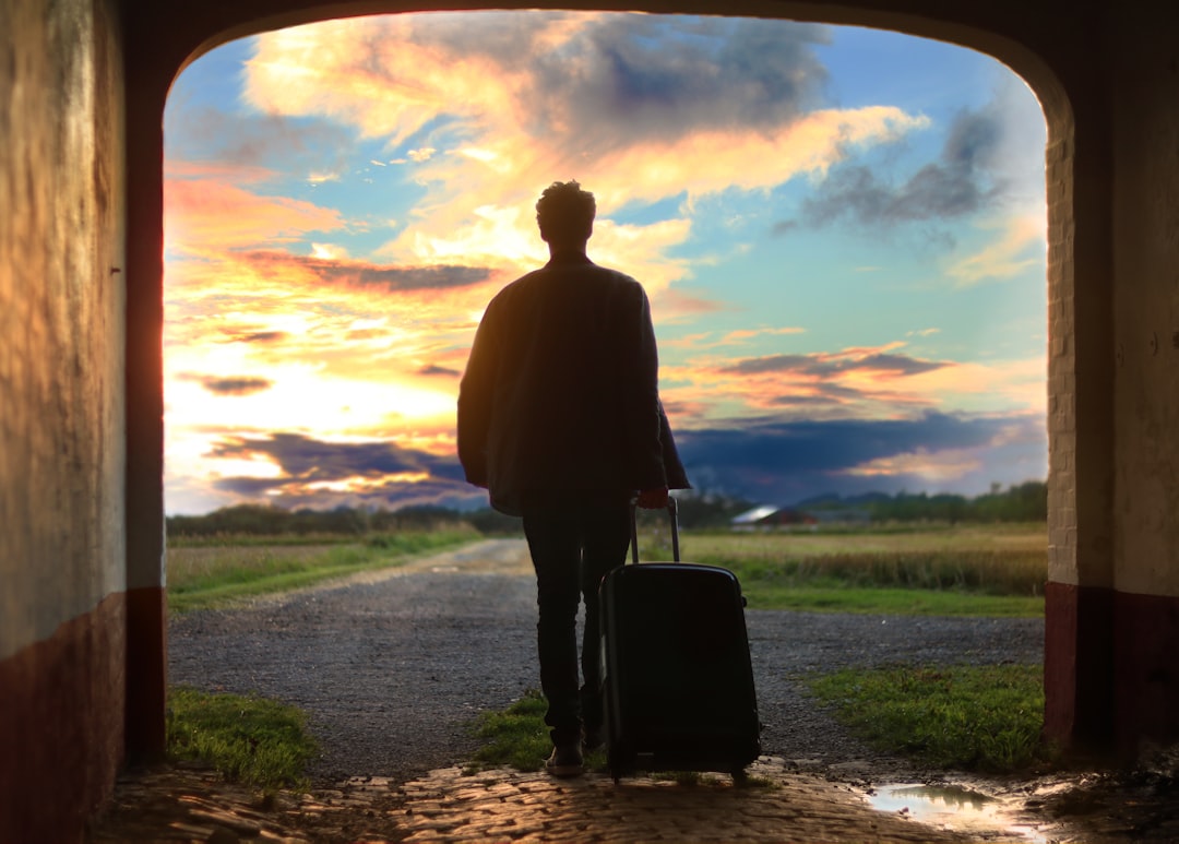 Traveler reviewing a brochure with essential questions to ask about travel insurance