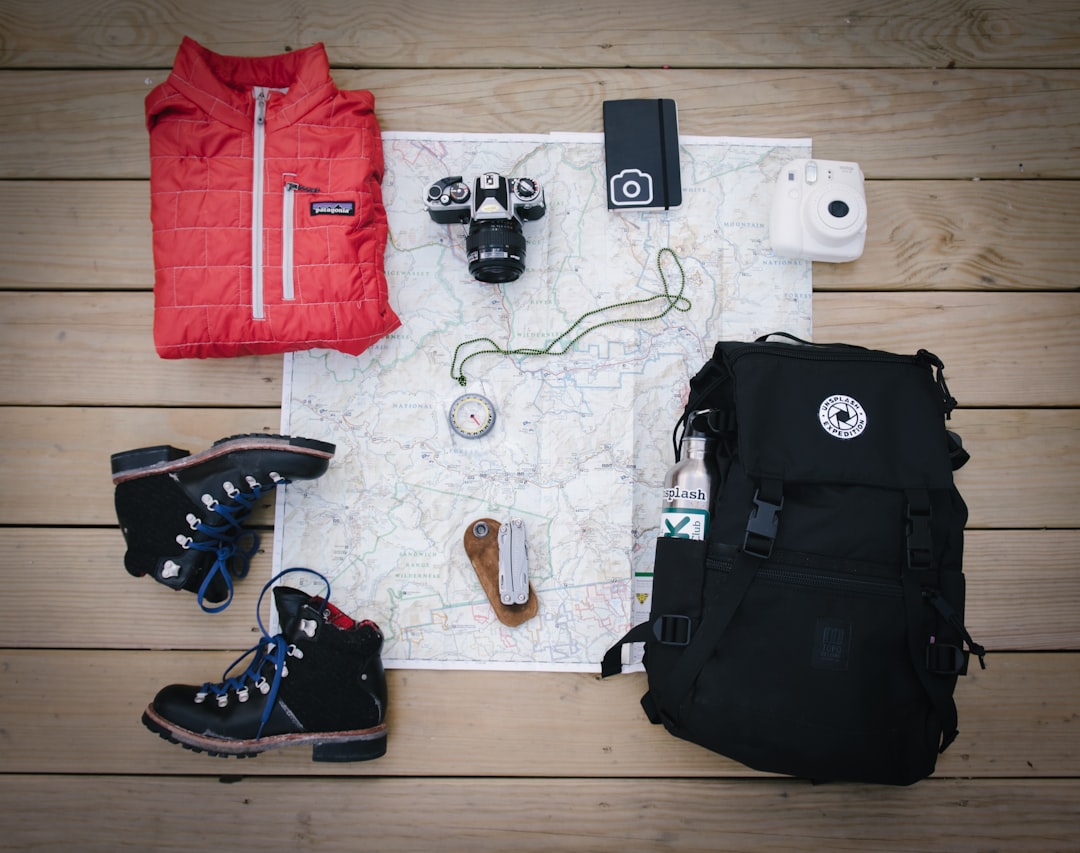 Adventurer on a mountain trail representing comprehensive guides on travel insurance coverage for adventurous activities